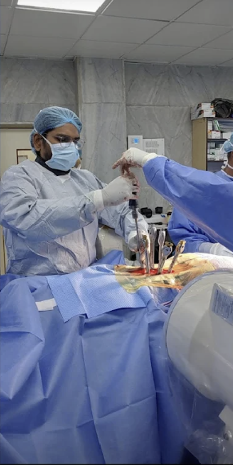 MIS Lumbar Fixation and Fusion in progress under fluoroscopic guidance