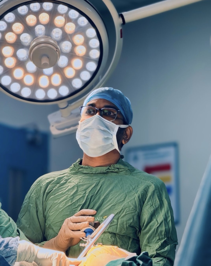 Dr. Hari Kishore during advanced joint replacement surgery in operating theatre under OT lights